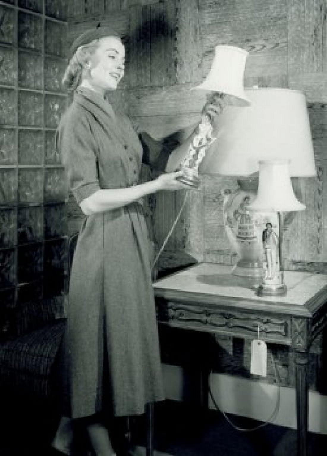 Woman watching lamp in shop Canvas Art - (18 x 24)