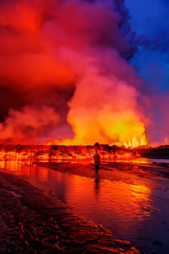 Woman watching the lava flow at the Holuhraun Fissure eruption near Bardarbunga Volcano Iceland Canvas Art - Panoramic Images (36 x 12)