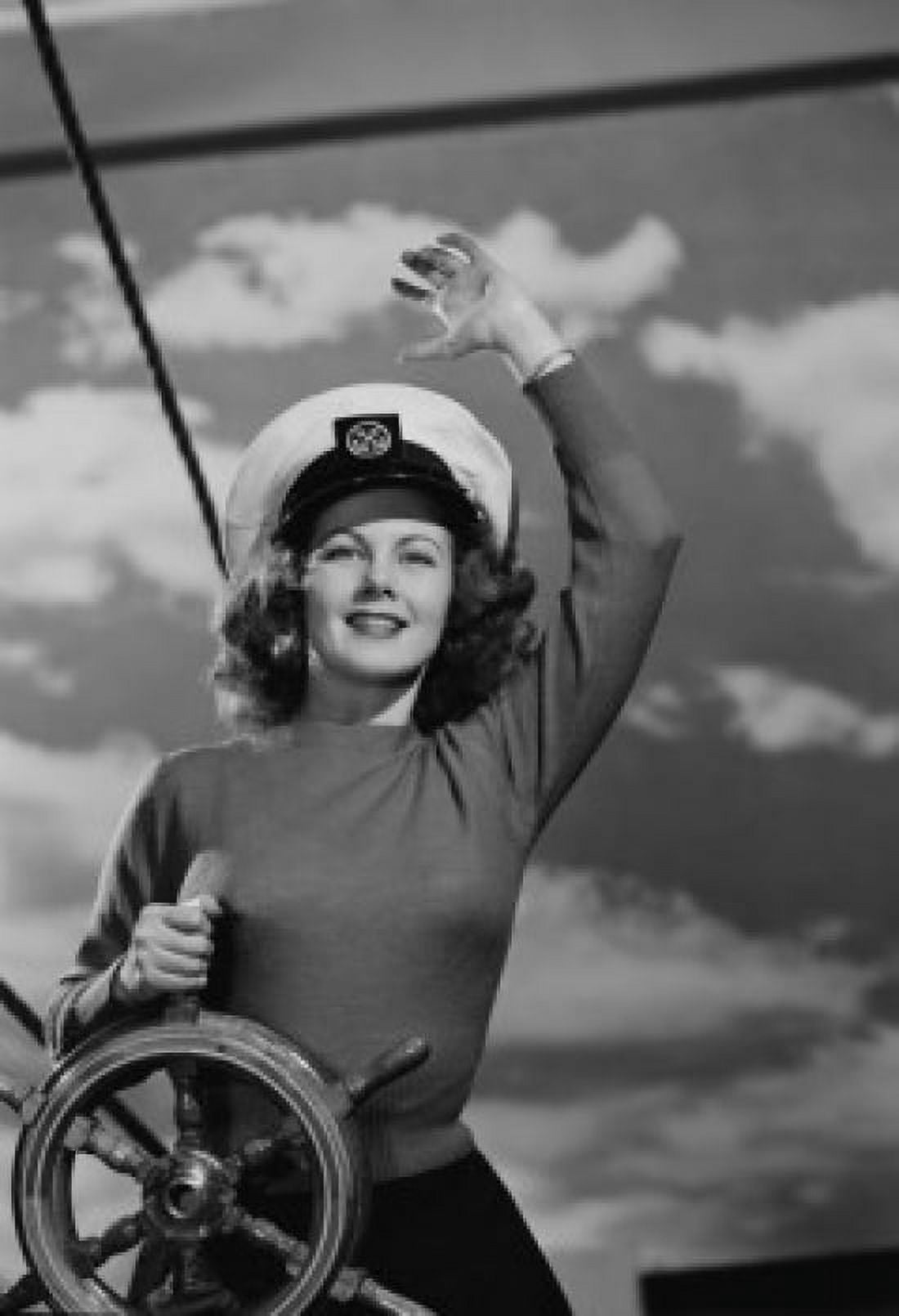 Woman wearing sailor hat at helm of ship Canvas Art - (18 x 24)