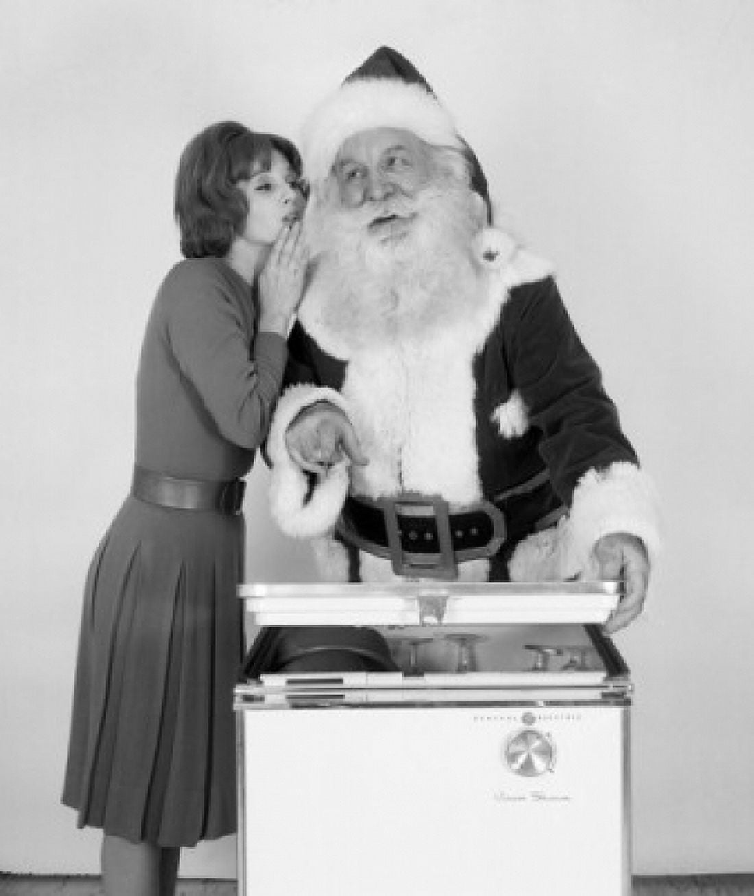 Woman whispering to Santa Claus Canvas Art - (24 x 36)