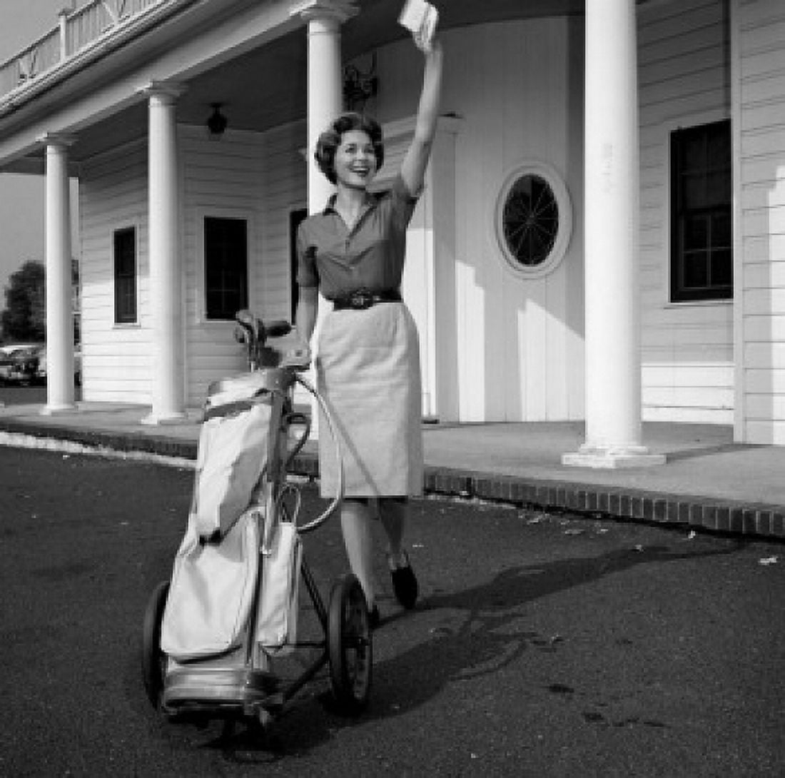 Woman with gold bag waving outside golf country club Canvas Art - (18 x 24)
