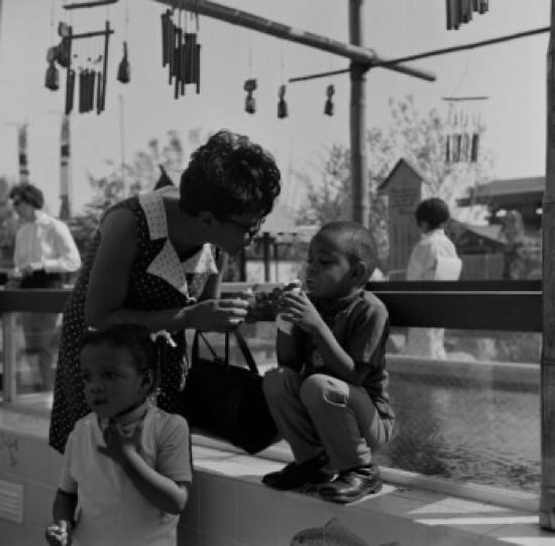 Woman with two sons outdoors Canvas Art - (24 x 36)