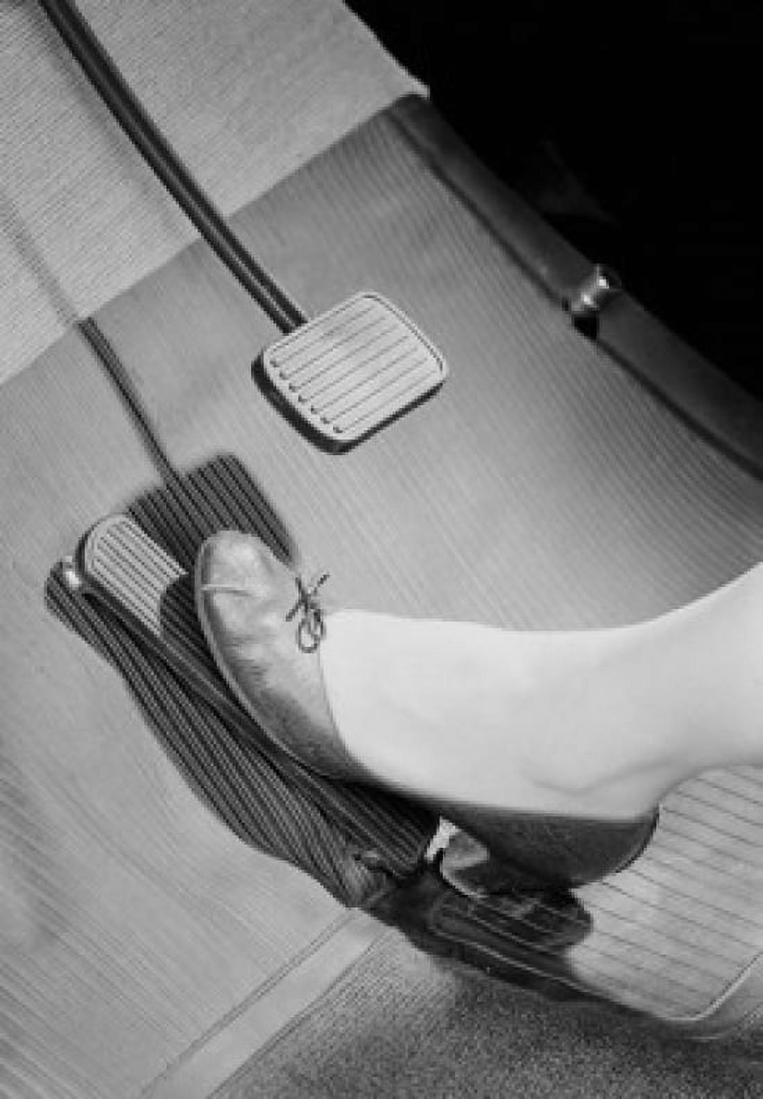 Womans foot on car brake pedal Canvas Art - (24 x 36)