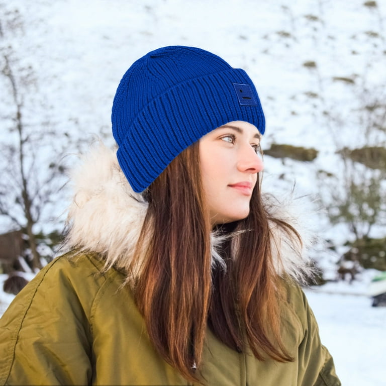 Woman in winter clothes in a hat fun winter landscape there is a