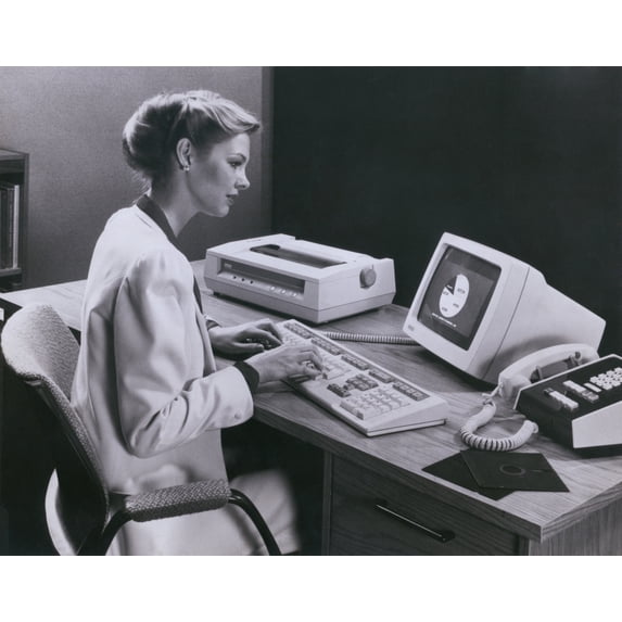 Women Using An Early Personal Computer Made By The Digital Equipment Corporation Of Maynard Massachusetts In 1982. The Computer Worked On Programs And Information From Large 5 14 Inch Floppy Discs