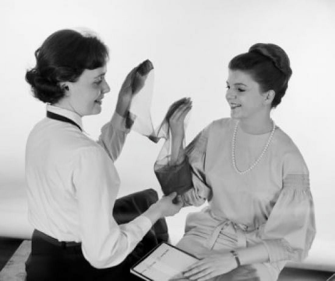 Women checking tights before buying Canvas Art - (24 x 36)