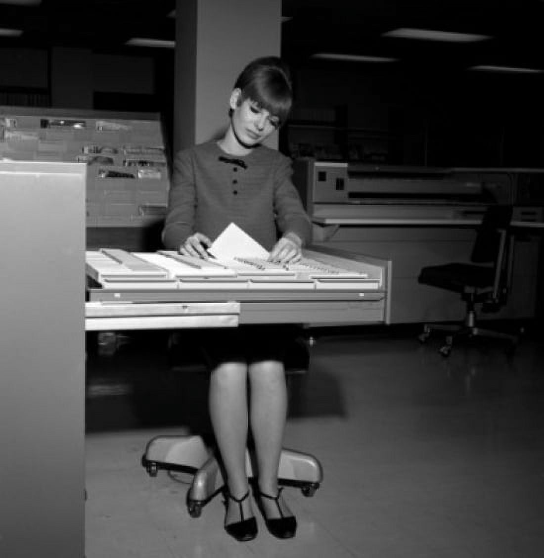 Women searching documents in office Canvas Art - (24 x 36)