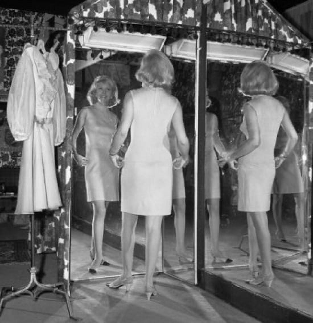 Women trying on dress Canvas Art - (24 x 36)