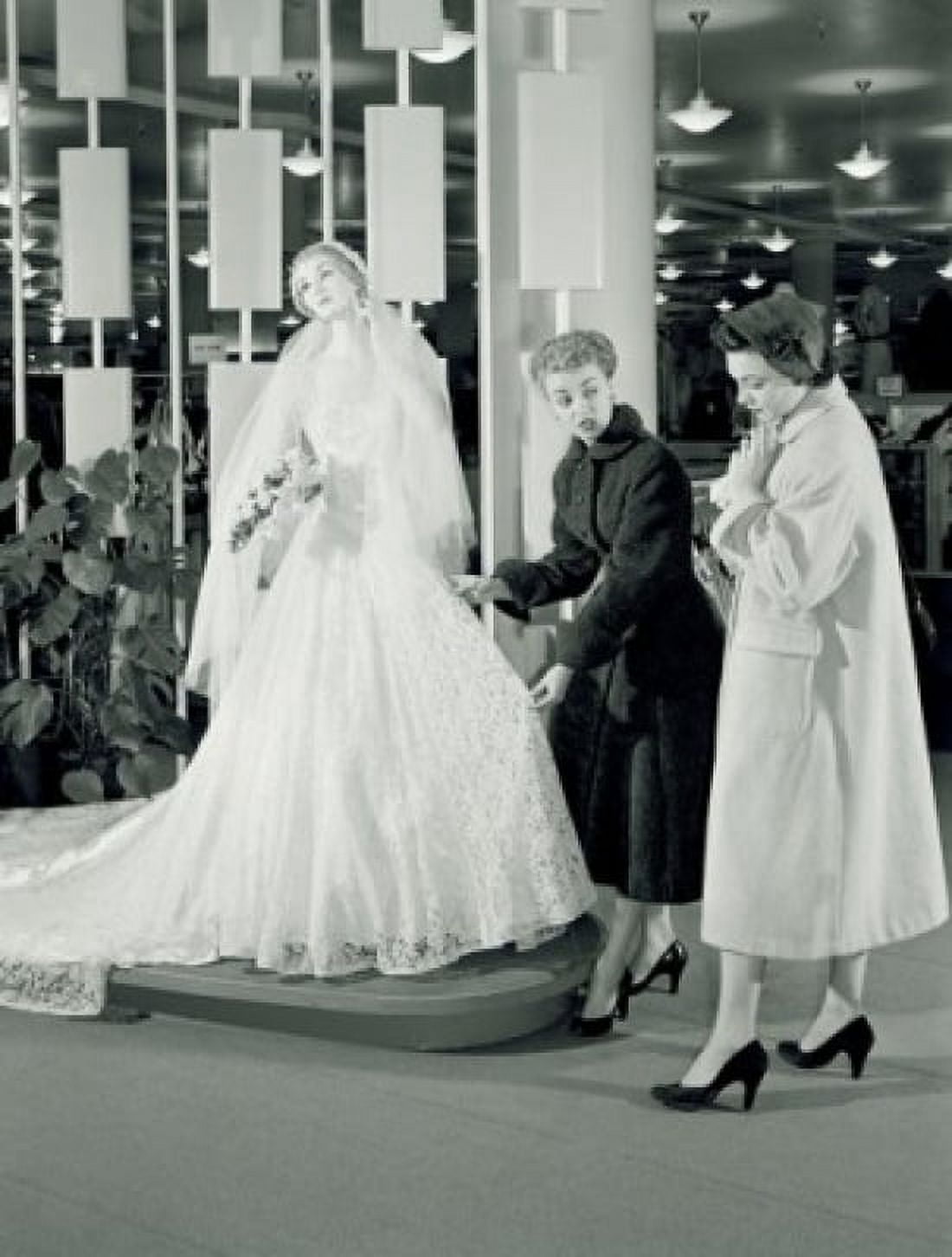 Women watching wedding dress in store Canvas Art - (18 x 24)
