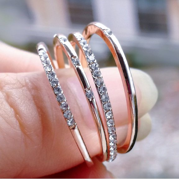 Womens Simple Geometric Golden Alloy Ring with Sparkling Rhinestone Inlay and Metal Stitch Detailing, Four-Piece Set