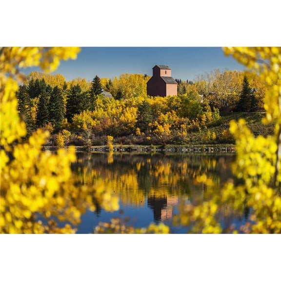 Wooden Grain Elevator Surrounded by Colourful Trees in Autumn Reflecting in a Lake with Blue Sky - Calgary Alberta Cana 1 Poster Print by Michael Interisano - 19 x 12
