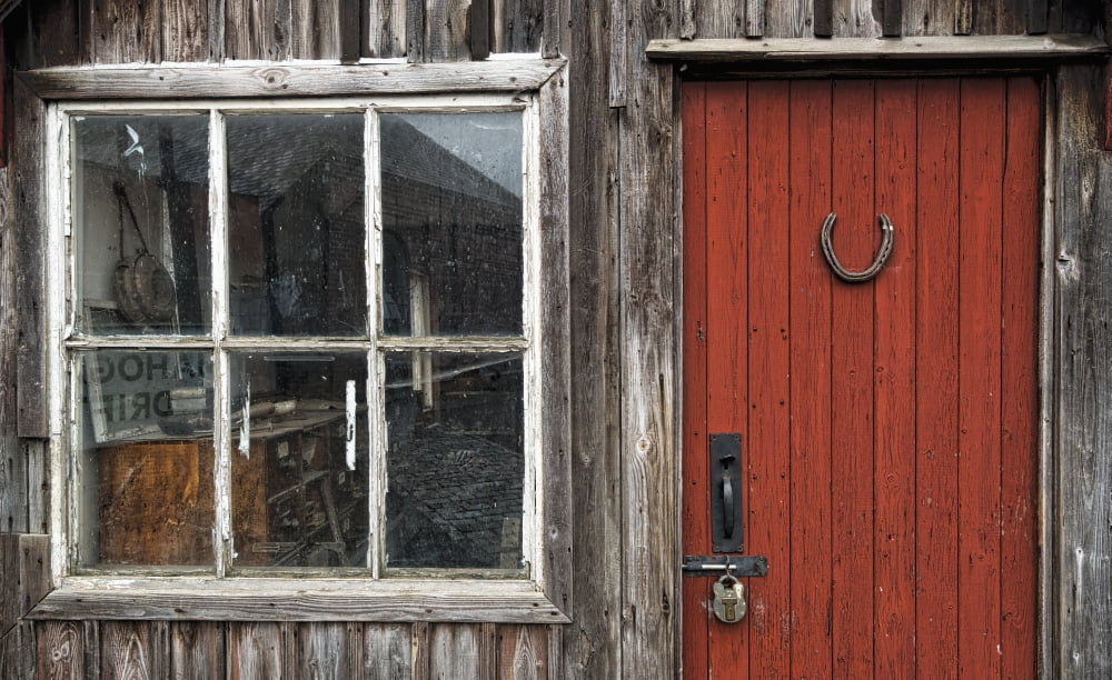Wooden building with red painted door padlock and window Beamish Durham England Canvas Art - John Short Design Pics (38 x 24)