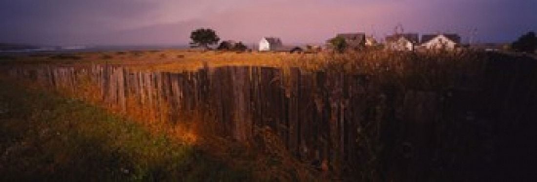 Wooden fence in a field with houses in the background Mendocino California USA Canvas Art - Panoramic Images (18 x 7)
