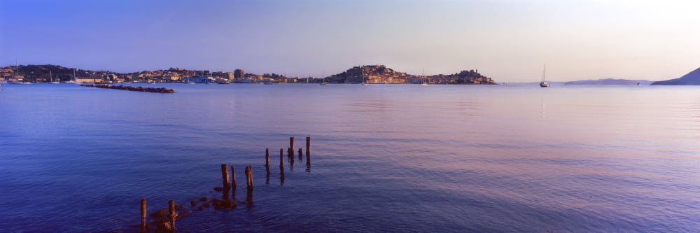 Wooden posts in sea Portoferraio Island of Elba Tuscany Italy Canvas Art - Panoramic Images (36 x 12)