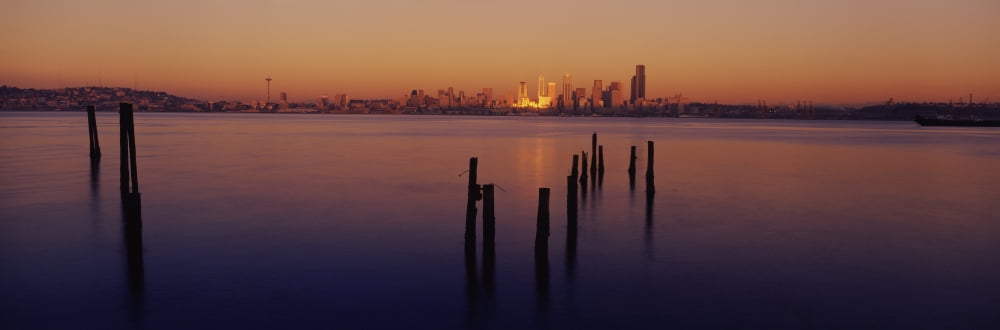 Wooden posts in the sea at dusk Seattle Washington State USA Canvas Art - Panoramic Images (6 x 18)