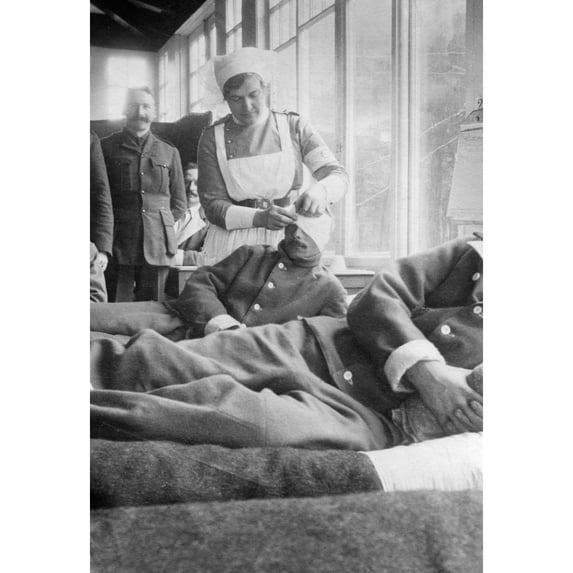 Wwi Hospital C1915. Na Nurse Bandaging The Head Of A Soldier At The Canadian Hospital In The Hotel Du Golf At Le