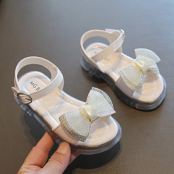 XIMIN Girls Open-Toe Sandals Rhinestone Bow Adjustable Buckle Strap Soft Upper Non-Slip Rubber Sole Cute Summer Beach Party Sandals (Beige, 2-2.5 Years)