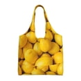 thumbnail image 1 of Xecao's Ripe Yellow Lemon Canvas Tote Bag is a versatile choice for women, serving as a stylish beach bag, shopping bag,and reusable grocery bag., 1 of 5