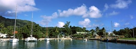 Yachts and small fishing boats at the harbor on La Digue Island Seychelles Canvas Art - Panoramic Images (36 x 13)