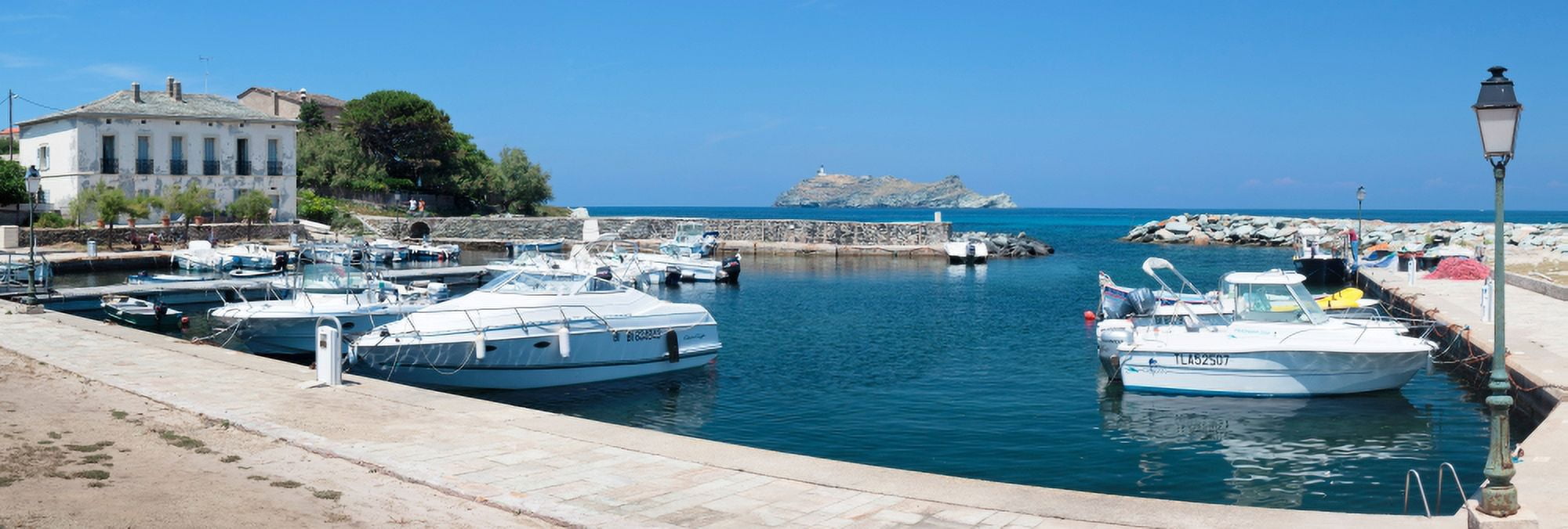 Yachts docked at a port Port Of Macinaggio Giraglia Island Corsica France Canvas Art - Panoramic Images (27 x 9)
