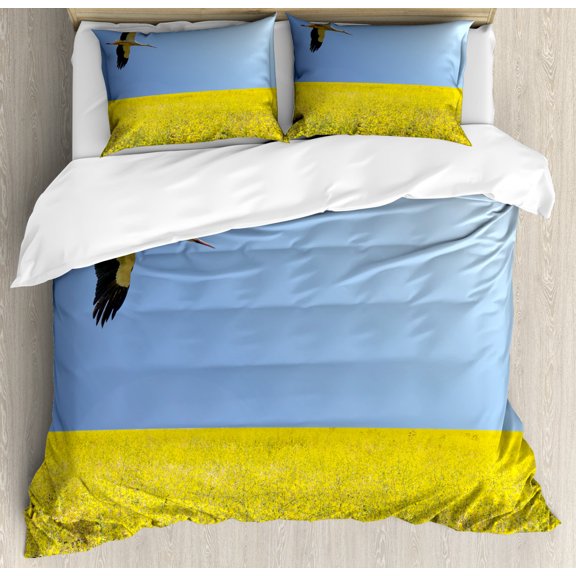 Yellow and Blue Duvet Cover Set King Size, Alone Stork Flying in Clear Sky over Spring Flowering Field Freedom Picture, Decorative 3 Piece Bedding Set with 2 Pillow Shams, Multicolor, by Ambesonne