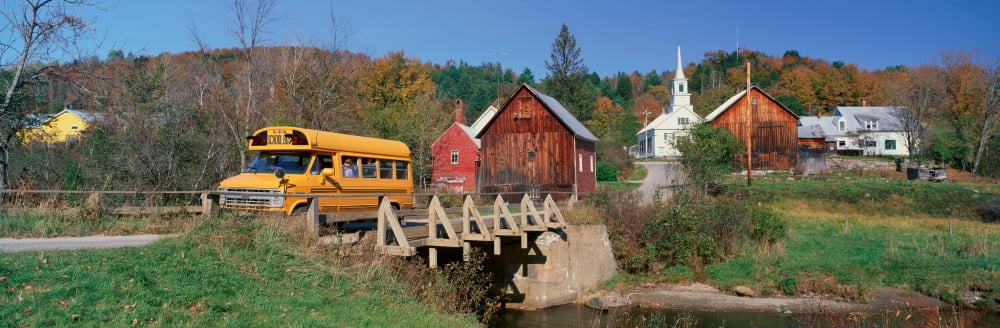 Yellow school bus crossing wooden bridge over Waits River in autumn VT Canvas Art - Panoramic Images (27 x 9)