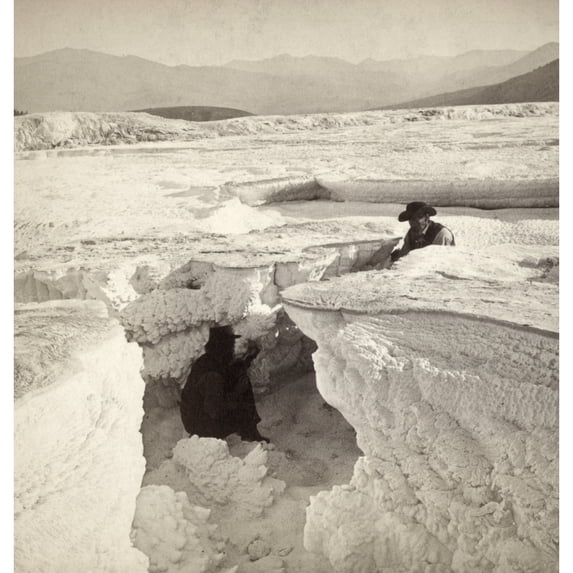 Yellowstone Park Crater. Nmen Sitting In The Crater Of Periodical Hot Lake And Leaf Formation In Mammoth Hot Springs On