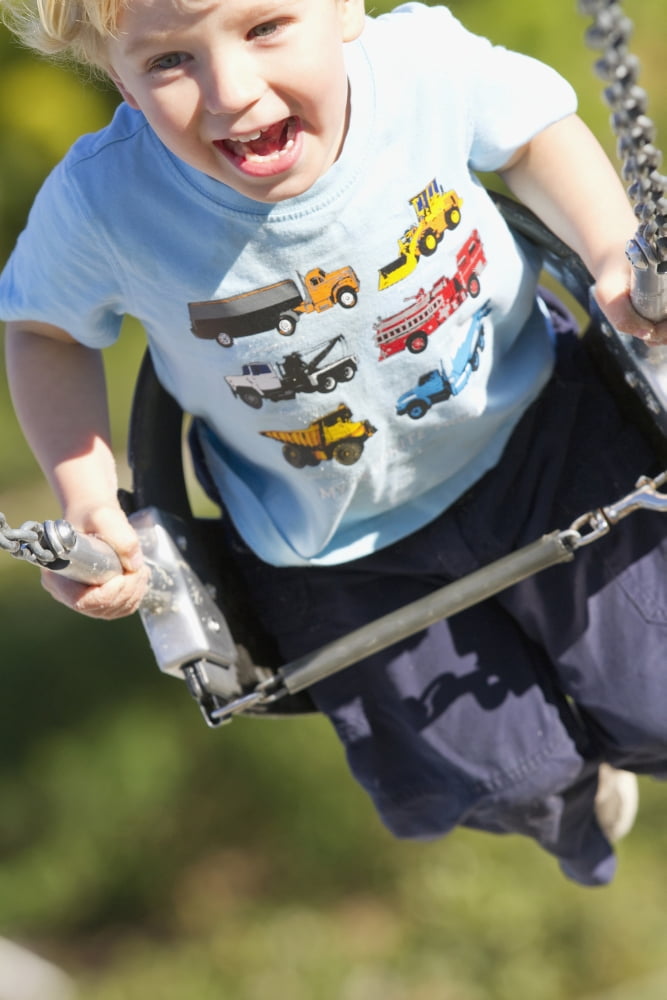 Young Boy Smiling Swinging In A Swing At The Playground Canvas Art - Robert Postma Design Pics (24 x 38)