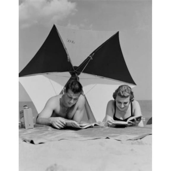Young Couple Reading Books on Beach Poster Print - 18 x 24 in.
