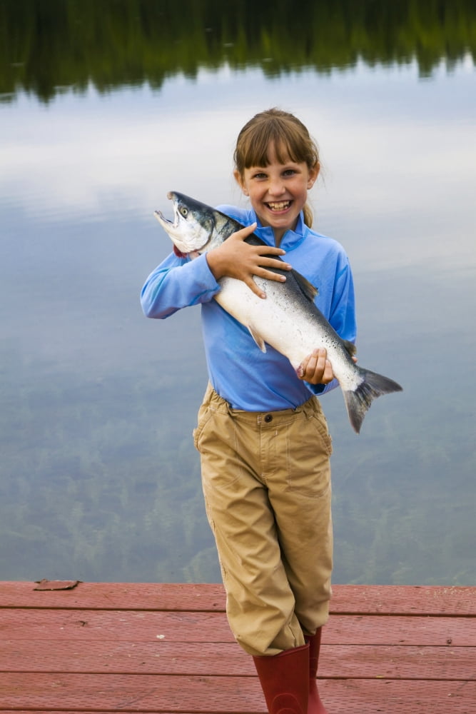 Young Girl Holding And Posing With A Coho Salmon At A Lake In Anchorage During Summer In Southcentral Alaska Canvas Art - Michael DeYoung Design Pics (11 x 17)
