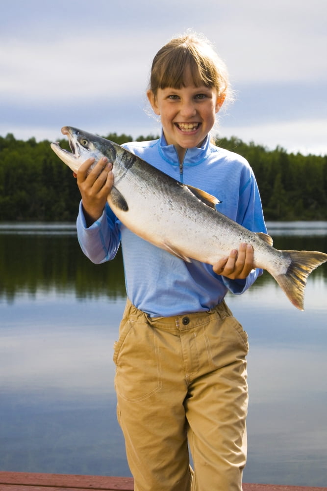 Young Girl Holding And Posing With A Coho Salmon At A Lake In Anchorage During Summer In Southcentral Alaska Canvas Art - Michael DeYoung Design Pics (11 x 17)