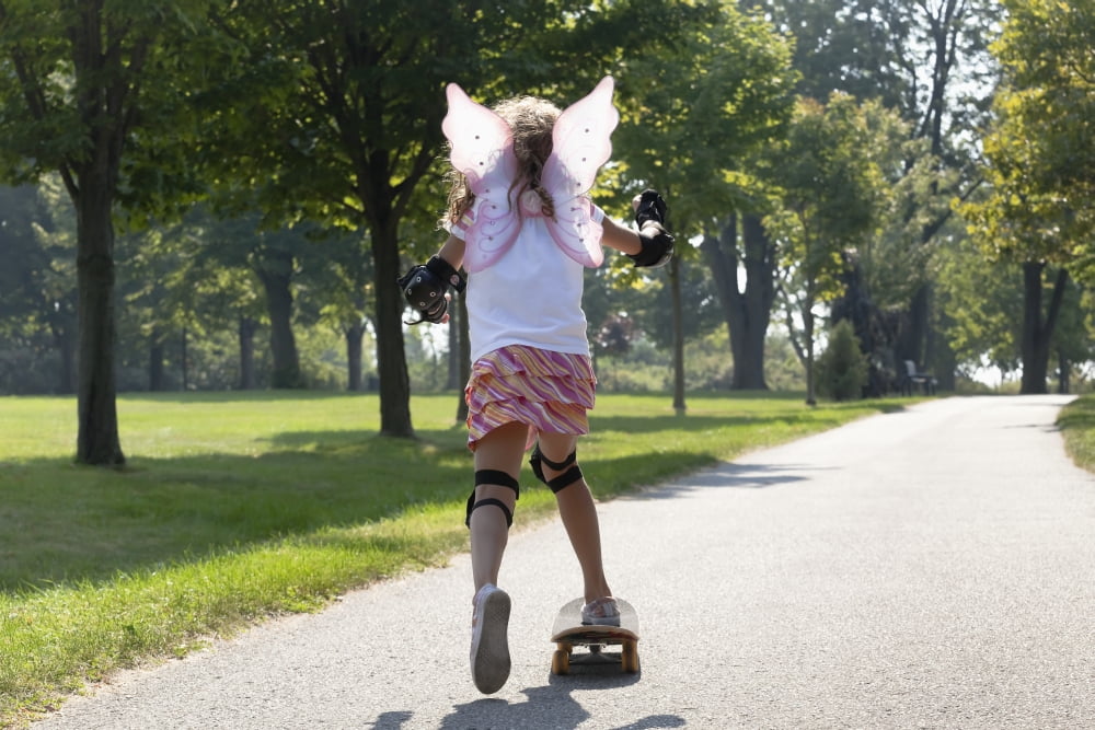 Young Girl Skateboarding While Wearing Fairy WingsWhitby Ontario Canada Canvas Art - Mary Ellen McQuay Design Pics (38 x 24)