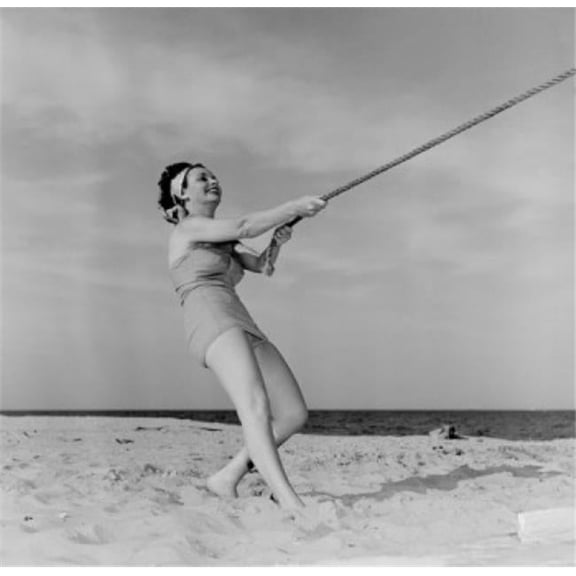 Young Happy Woman Pulling Rope at Beach Poster Print - 18 x 24 in.