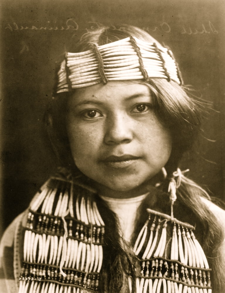 Young Indian, head-and-shoulders portrait, facing front, wearing shell ...