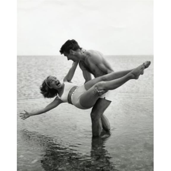 Young Man Carrying Young Woman on Beach Poster Print - 18 x 24 in.
