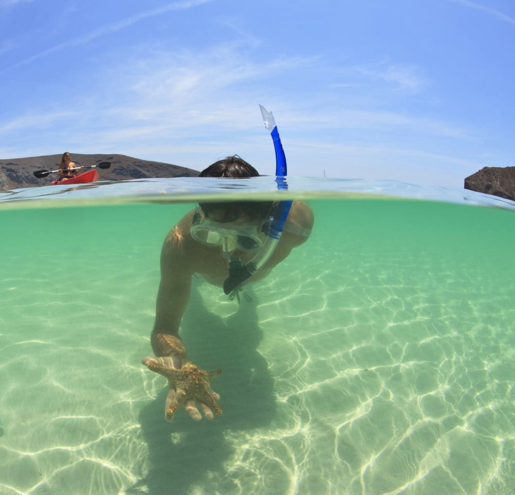 A Young Man Snorkels Holding A Starfish Underwater And Another Person Paddling A Boat La Paz Baja California Sur Mexico Canvas Art - Stuart Westmorland Design Pics (15 x 15)