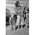 thumbnail image 1 of Young Mother Dressed In A Ragged Sweater And A Skirt Made Of A Flour Sack With Three Children Also Dressed In Rags. She Lives With Eight Others In A Field On Us Route 70 Between Camden And Bruceton, 1 of 1