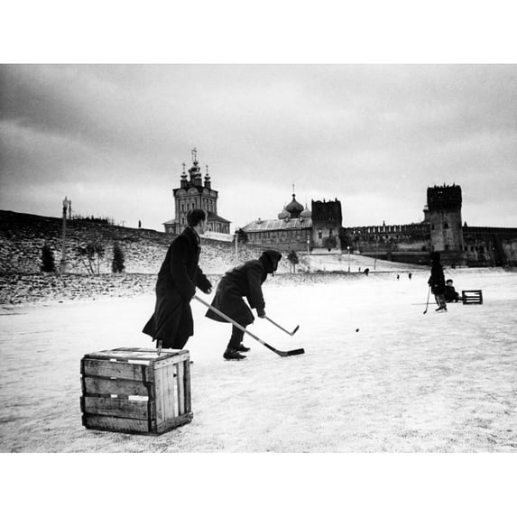Young Russians Playing Hockey On A Frozen Pond History (36 x 24)