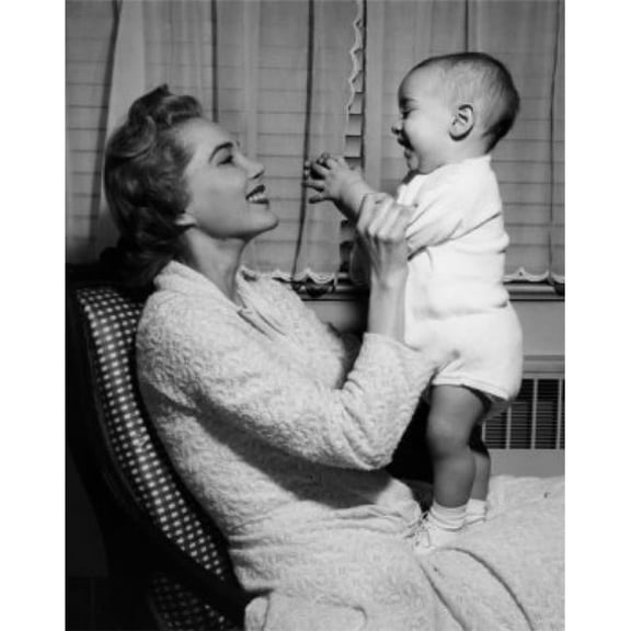 Young Woman Playing with Baby Boy Poster Print - 18 x 24 in.