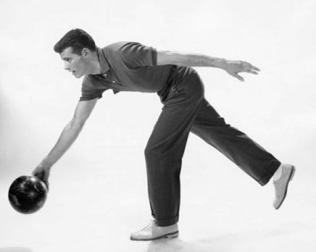 Young adult man rolling a bowling ball Canvas Art - (24 x 36)