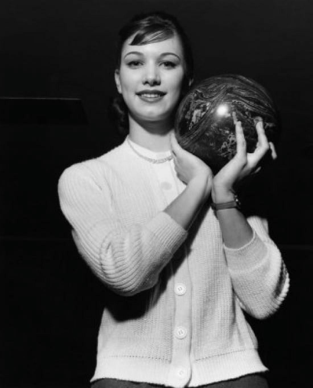 Young adult woman holding a bowling ball Canvas Art - (18 x 24)