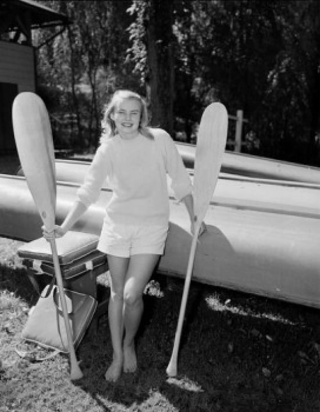 Young attractive woman posing with paddles Canvas Art - (24 x 36)