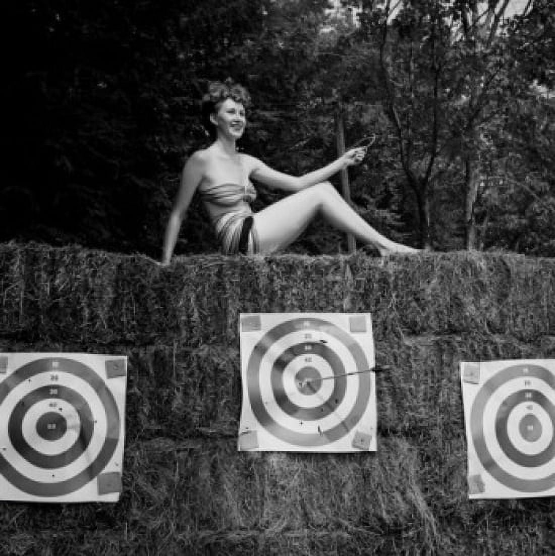Young attractive woman sun bathing in shooting range Canvas Art - (24 x 36)