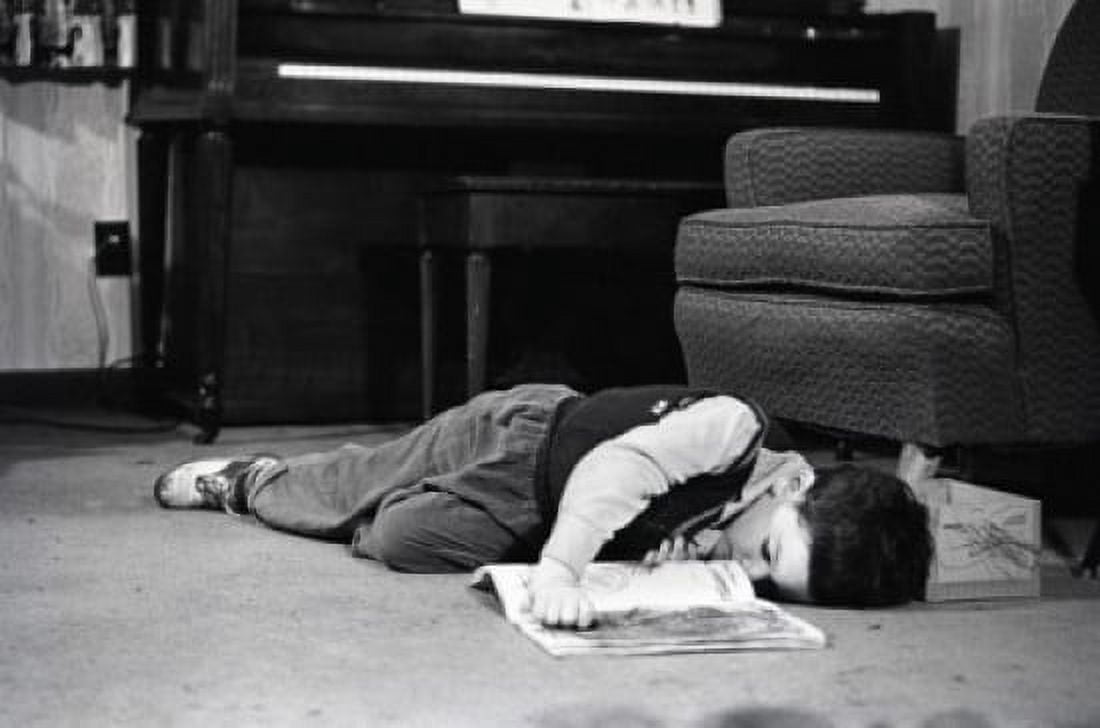 Young boy sleeping on floor Canvas Art - (18 x 24)