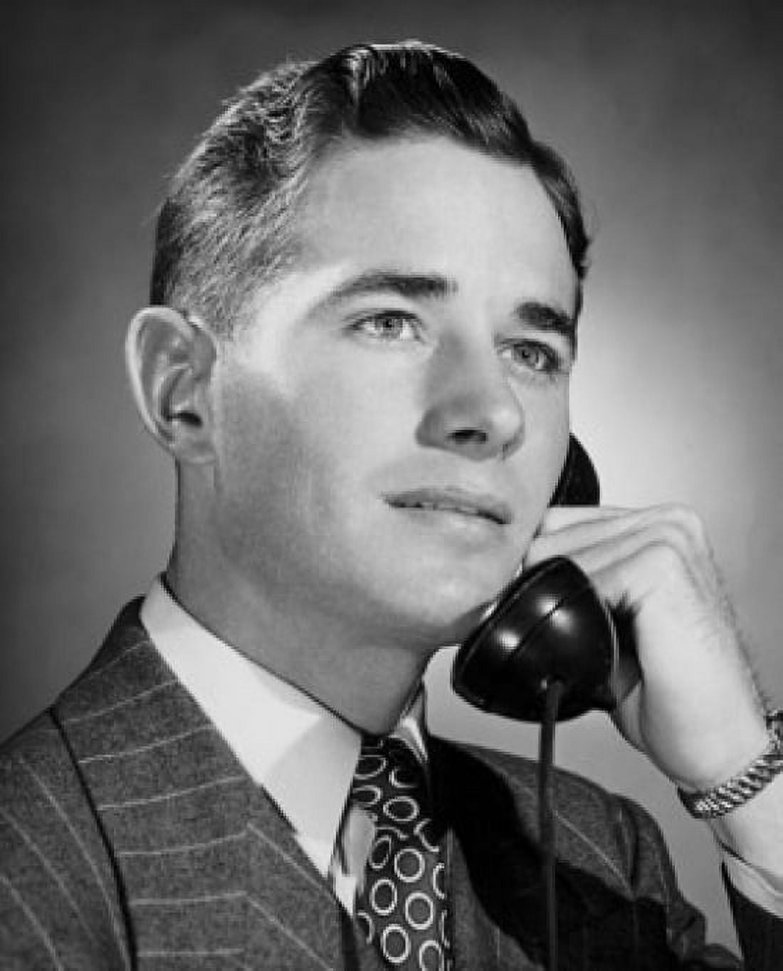 Young businessman using telephone Canvas Art - (24 x 36)