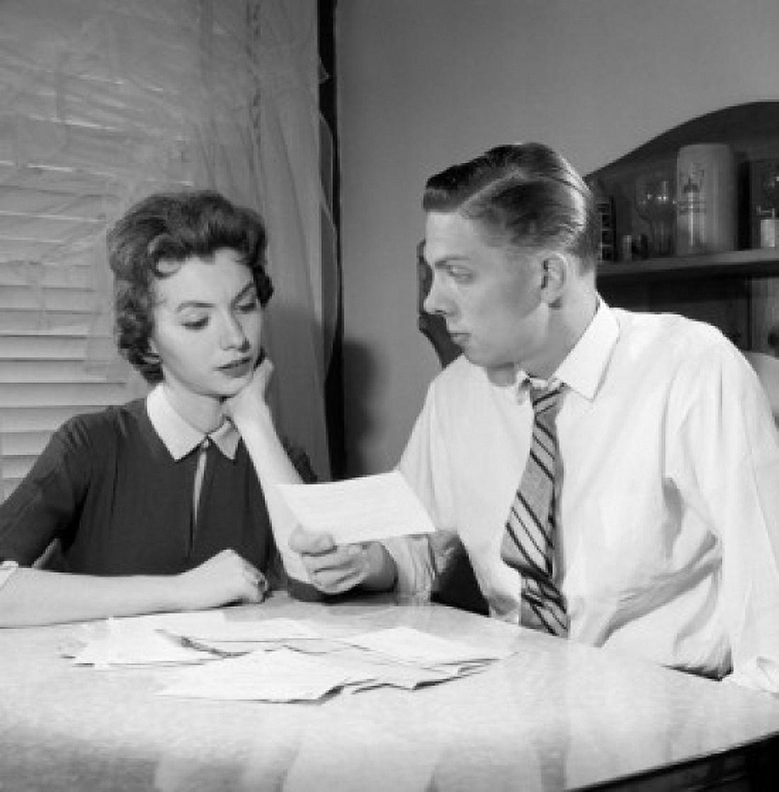 Young couple checking bills at table Canvas Art - (24 x 36)