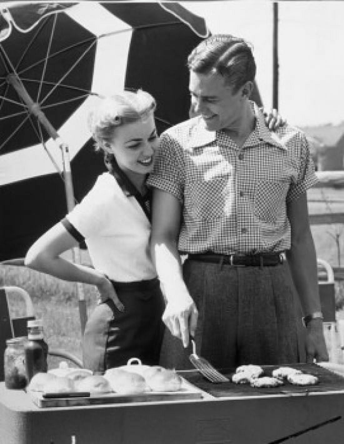 Young couple cooking food on barbecue grill Canvas Art - (24 x 36)