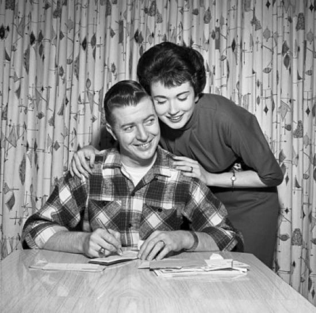 Young couple counting bills Canvas Art - (18 x 24)