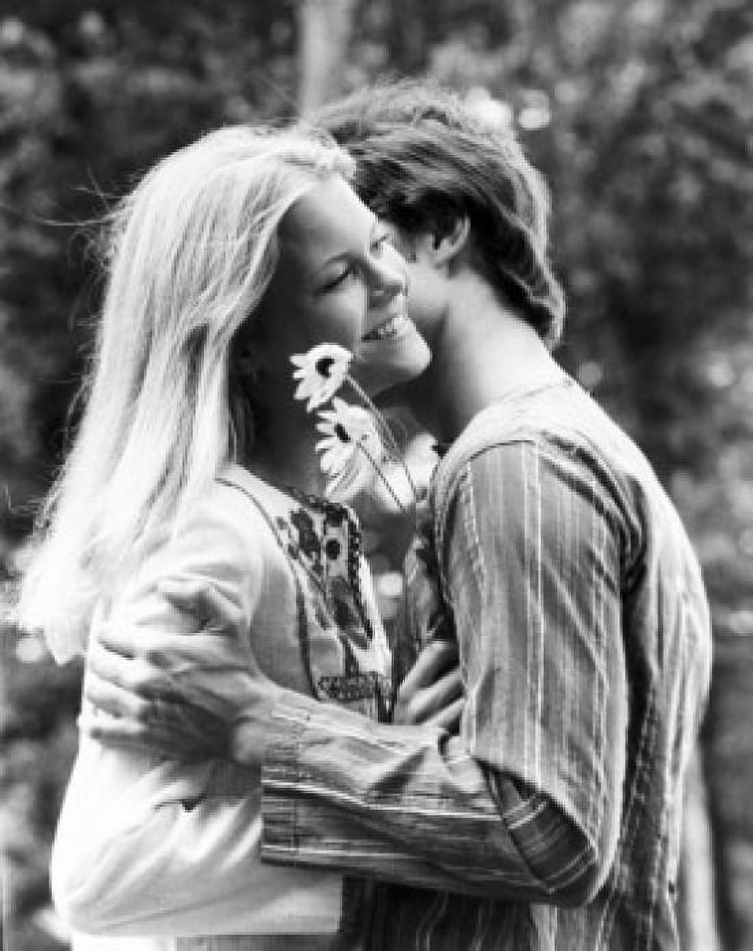Young couple embracing in a park Canvas Art - (18 x 24)