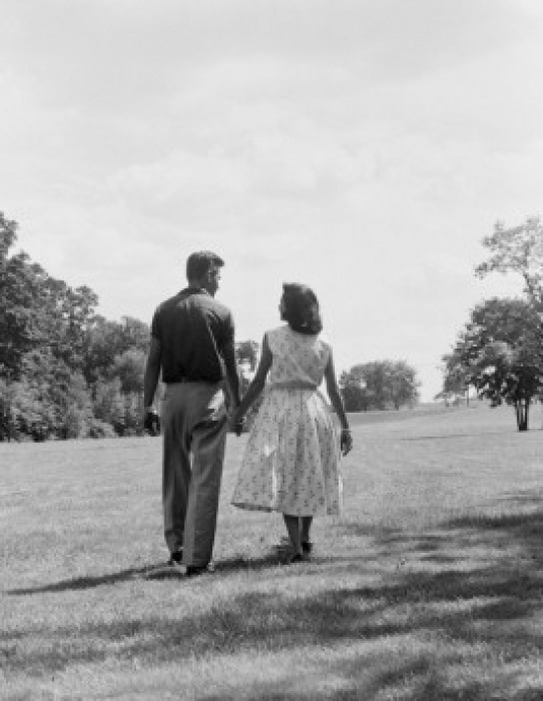 Young couple holding hands and walking Canvas Art - (18 x 24)